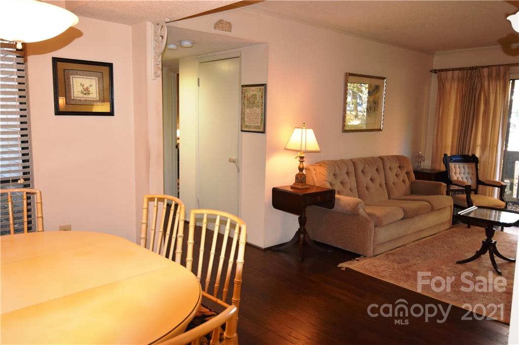4906 Sardis Road, Unit E Charlotte, NC 28270 - Photo 6 of 24 a living room with furniture and wooden floor