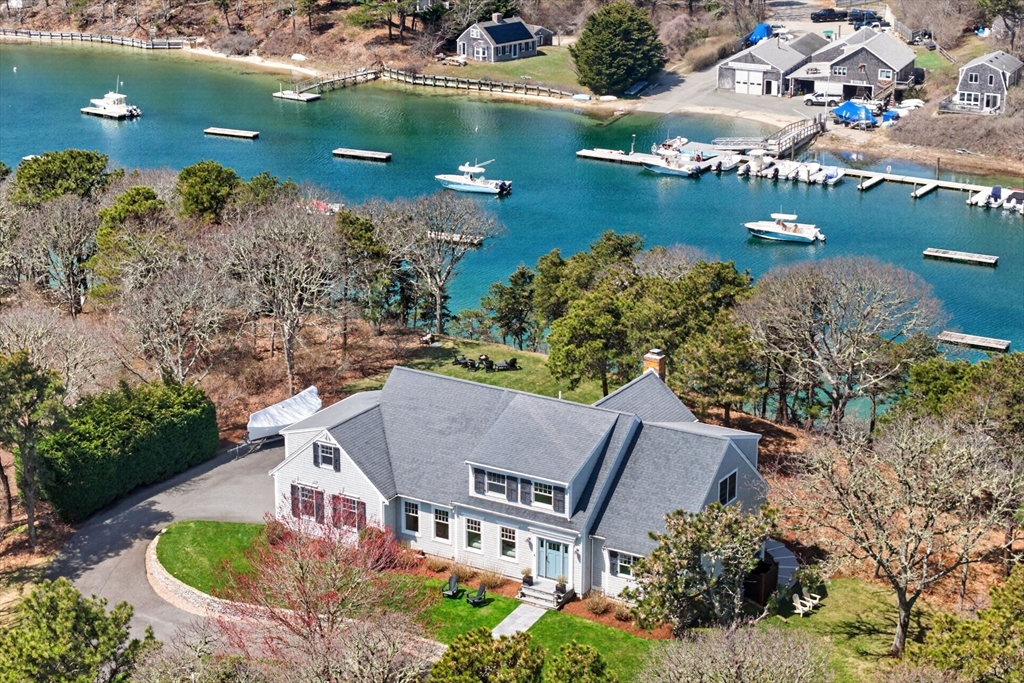 70 Judges Way Chatham, MA 02633 - Photo 1 of 41 an aerial view of a house with a lake view