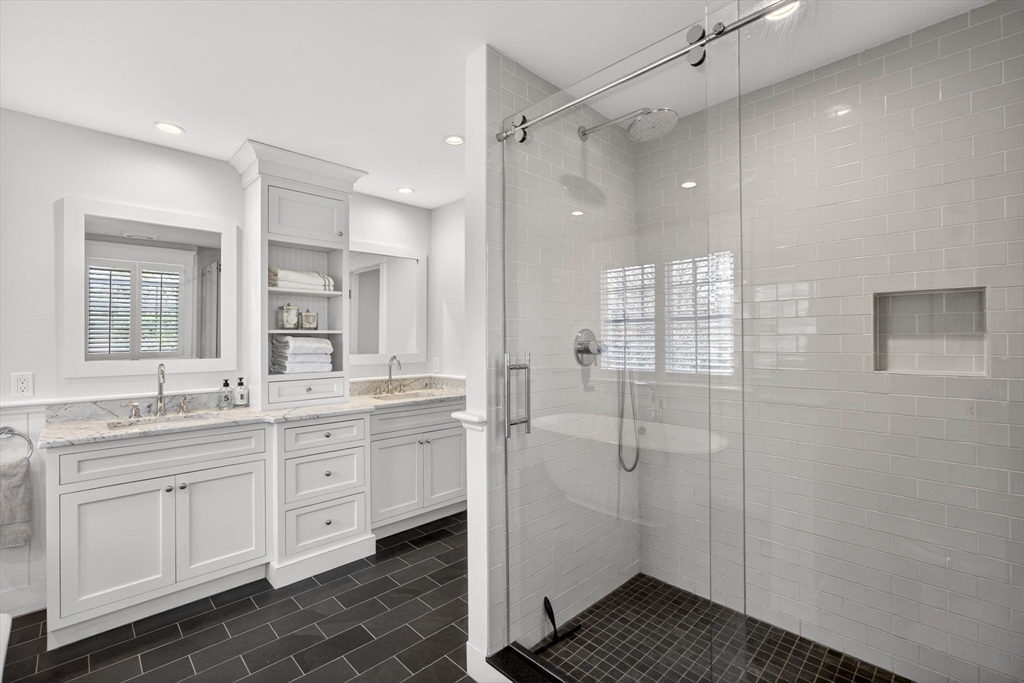 70 Judges Way Chatham, MA 02633 - Photo 17 of 41 a bathroom with a double vanity sink a mirror a shower and a bathtub