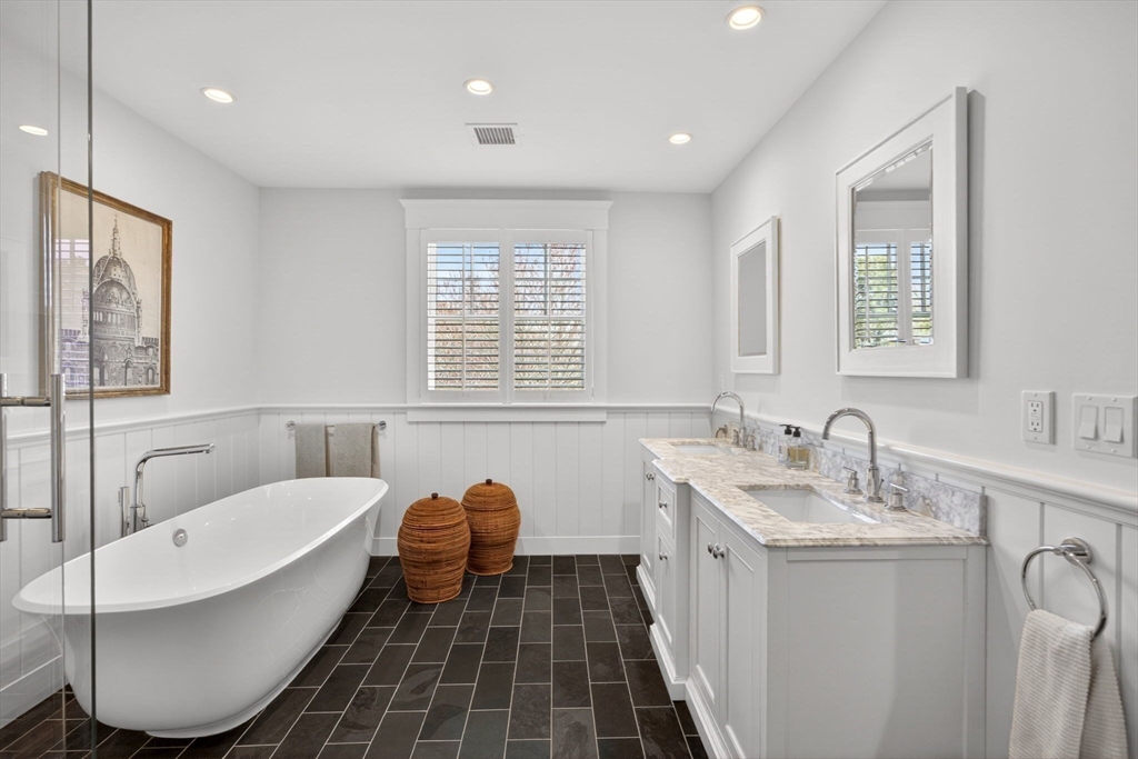 70 Judges Way Chatham, MA 02633 - Photo 24 of 41 a bathroom with a double vanity sink a mirror and a bathtub