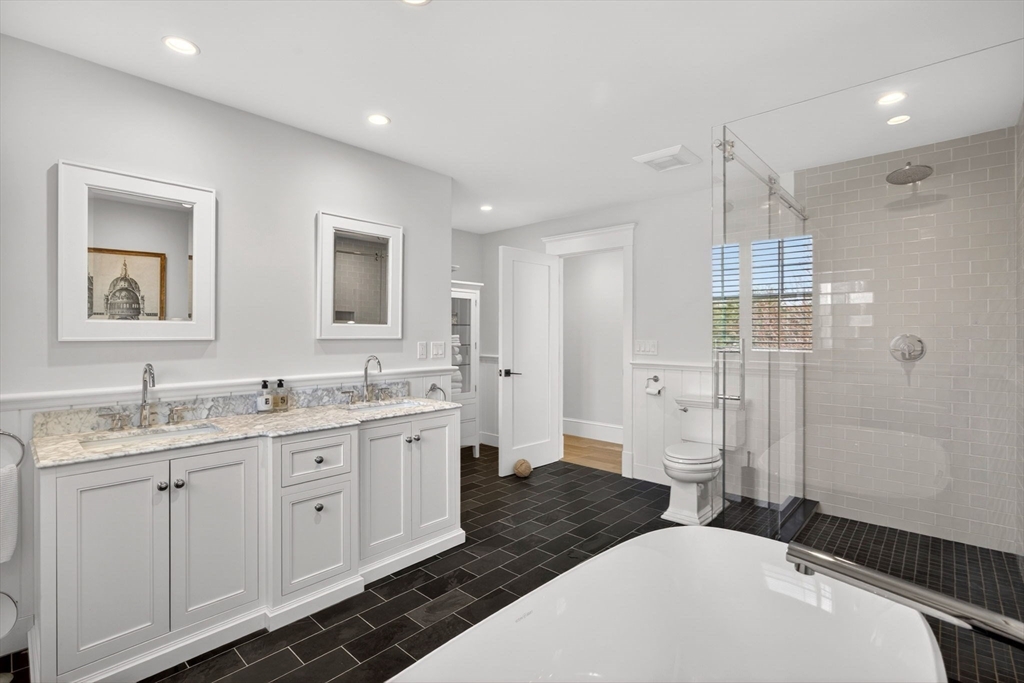 70 Judges Way Chatham, MA 02633 - Photo 26 of 41 a spacious bathroom with a granite countertop sink a toilet a shower and a mirror