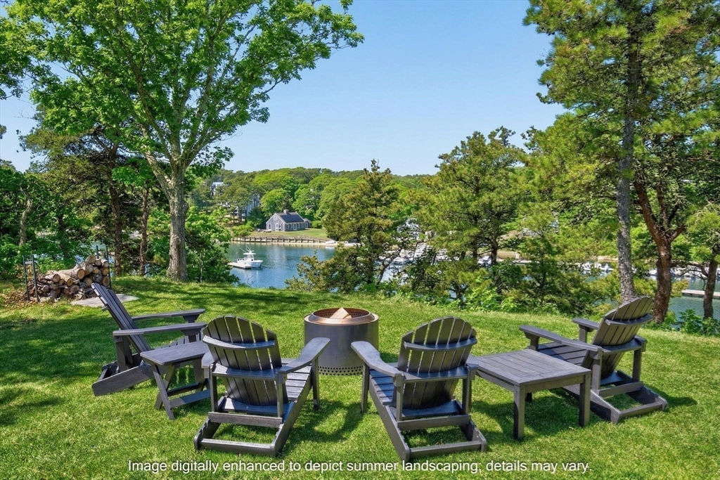 70 Judges Way Chatham, MA 02633 - Photo 35 of 41 a view of a table and chairs in the garden