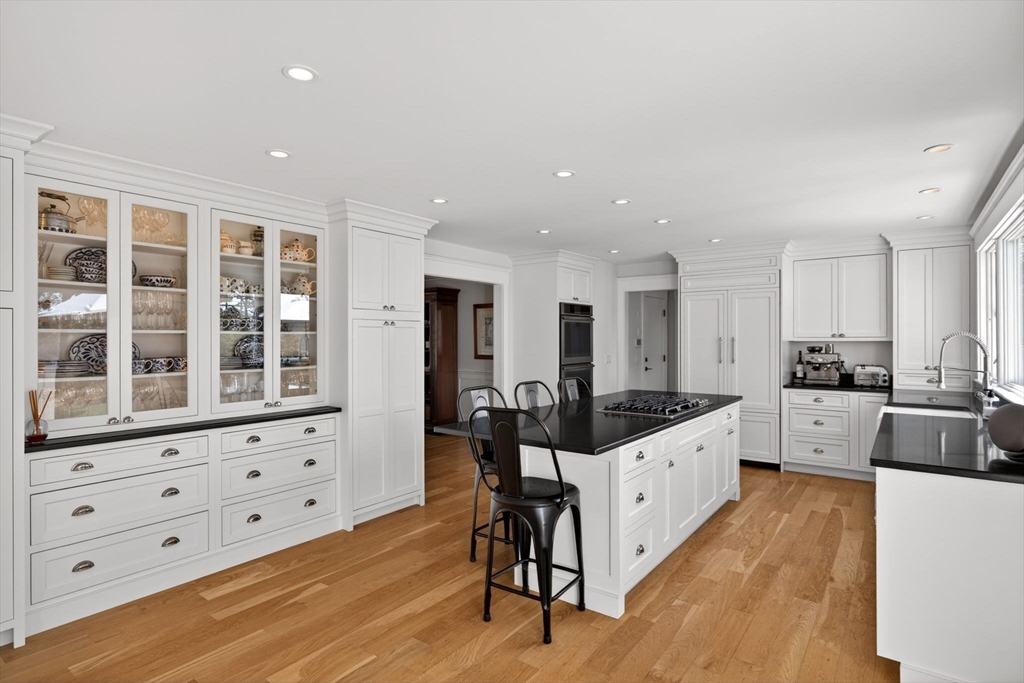 70 Judges Way Chatham, MA 02633 - Photo 6 of 41 a large white kitchen with granite countertop a large counter top space and stainless steel appliances