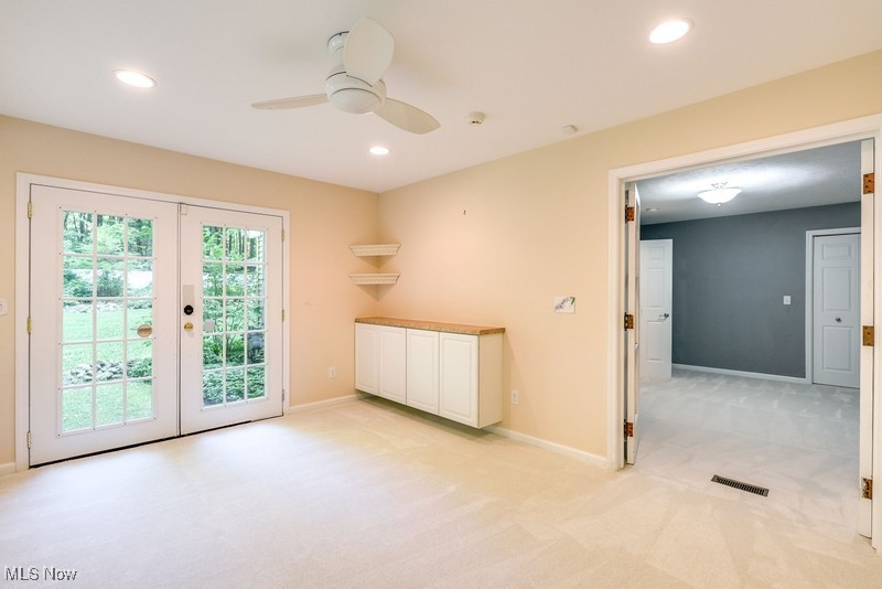 8648 Taylor May Road Chagrin Falls, OH 44023 - Photo 20 of 37 Spare room with plenty of natural light, ceiling fan, light carpet, and french doors