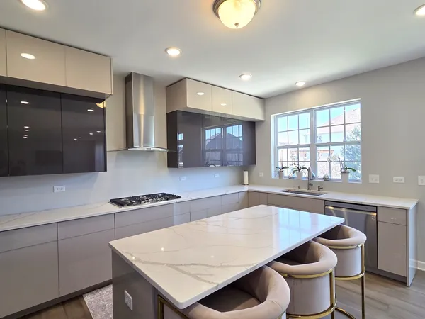 a kitchen with a table and chairs