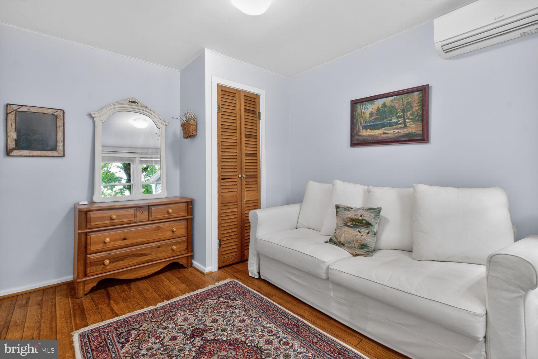 51 Ridge Road Greenbelt, MD 20770 - Photo 13 of 23 a living room with furniture and a window