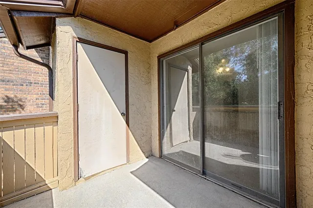 a view of a door with a glass door and door