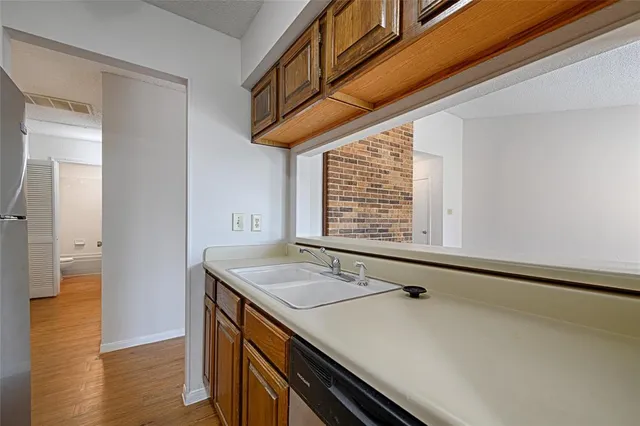 a bathroom with a sink and a window