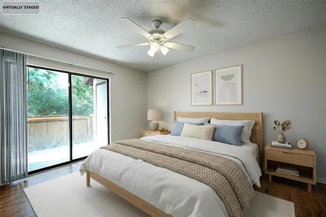 a bedroom with a large bed and a window