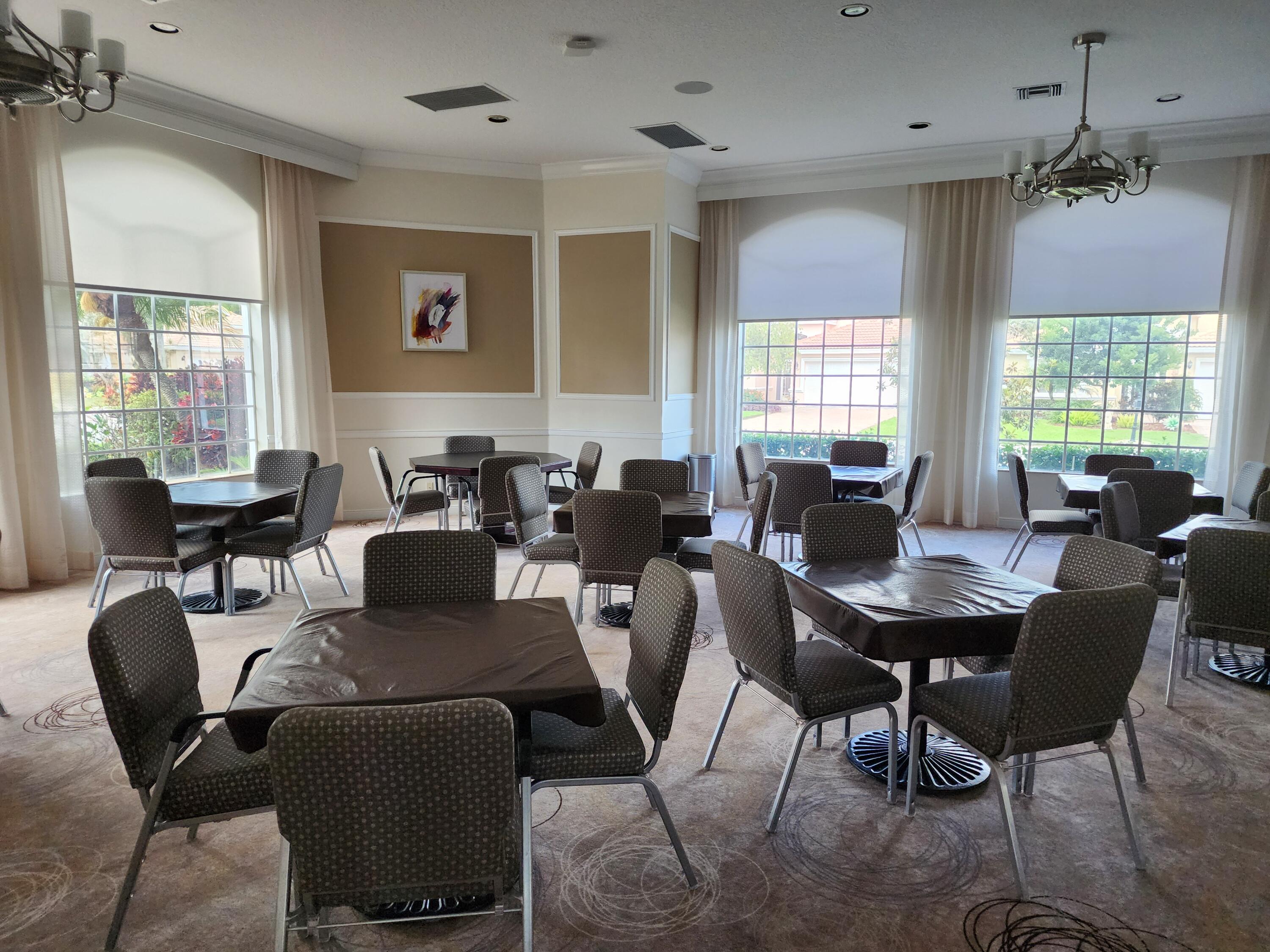 7316 Modena Drive Boynton Beach, FL 33437 - Photo 18 of 24 a view of a dining room with furniture window and wooden floor