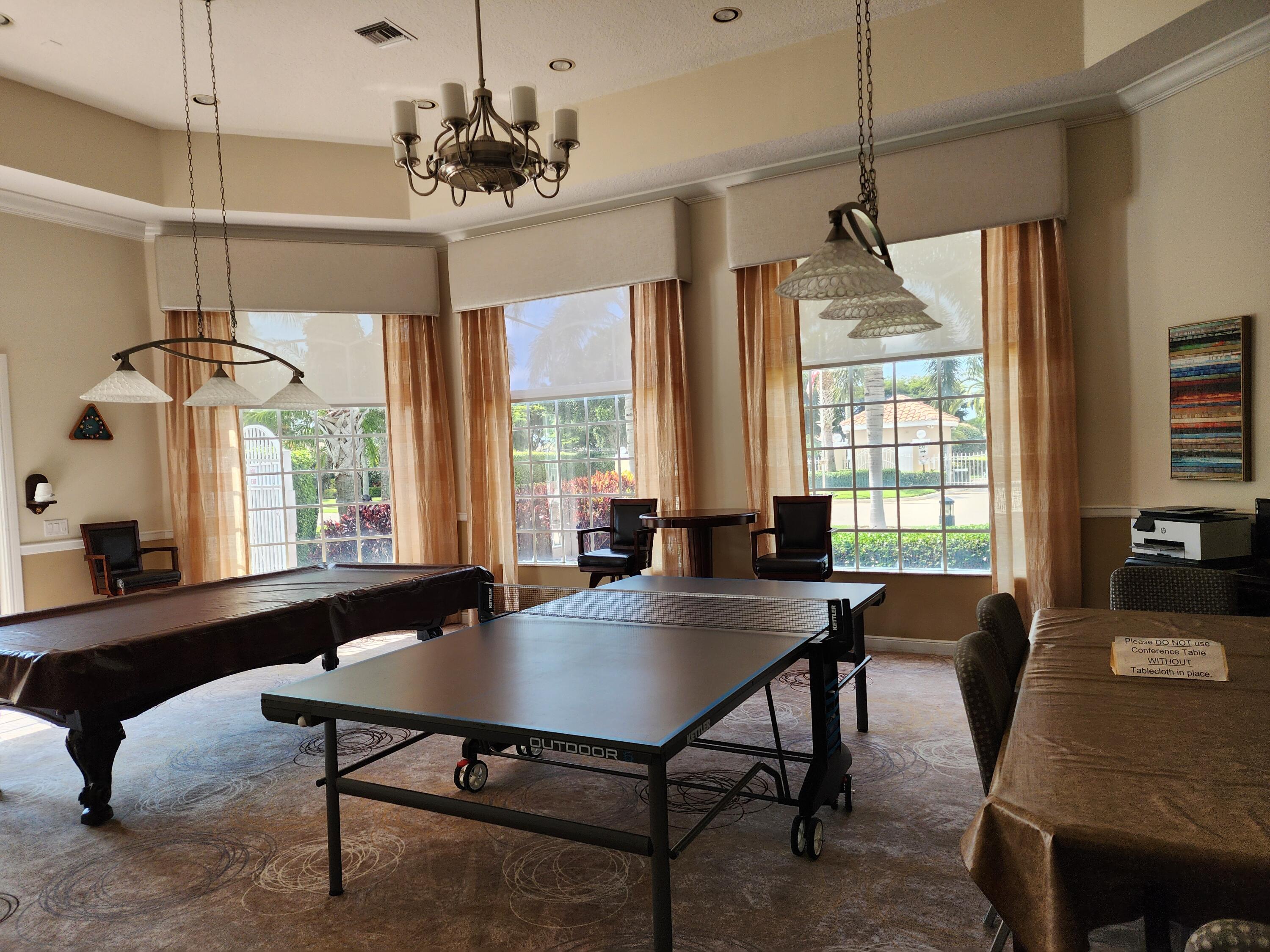7316 Modena Drive Boynton Beach, FL 33437 - Photo 19 of 24 a view of a dining room with furniture window and wooden floor