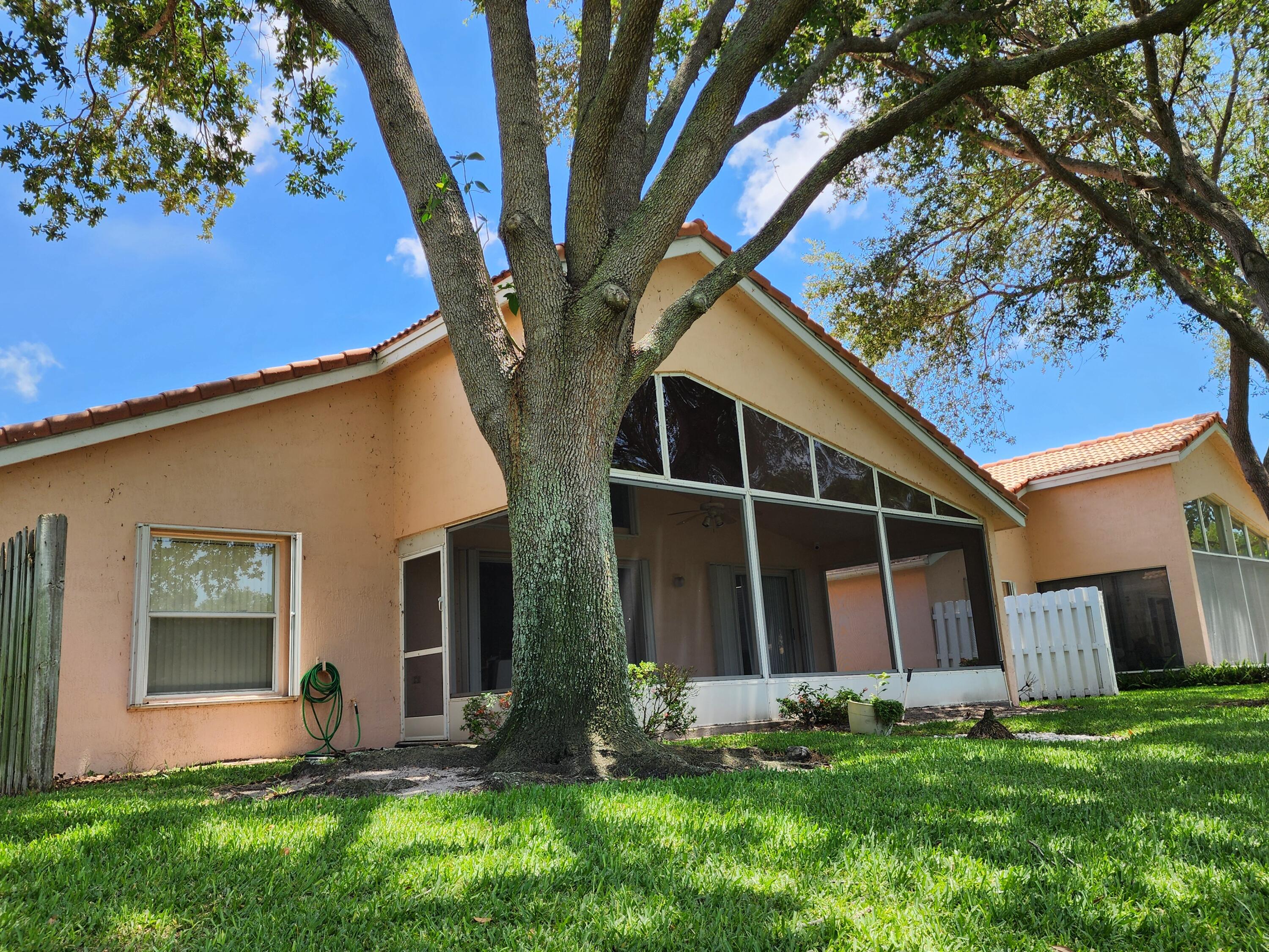 7316 Modena Drive Boynton Beach, FL 33437 - Photo 7 of 24 a front view of house with yard