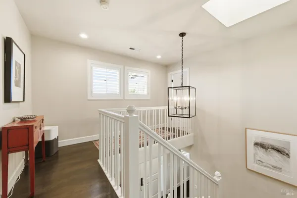 a view of a hallway with windows