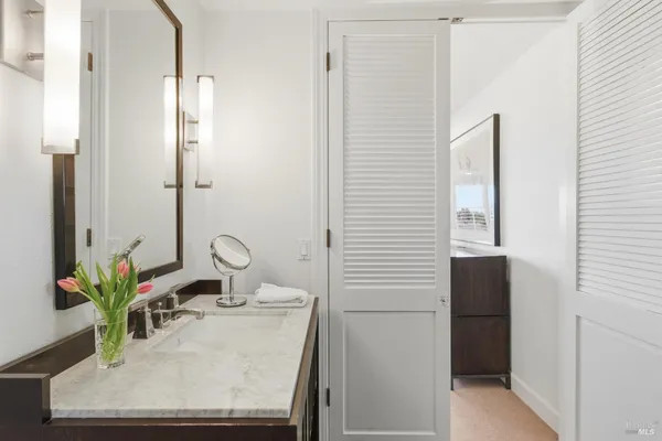 a room with a sink and a mirror