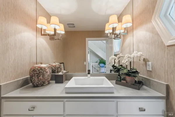 a bathroom with a sink and mirror