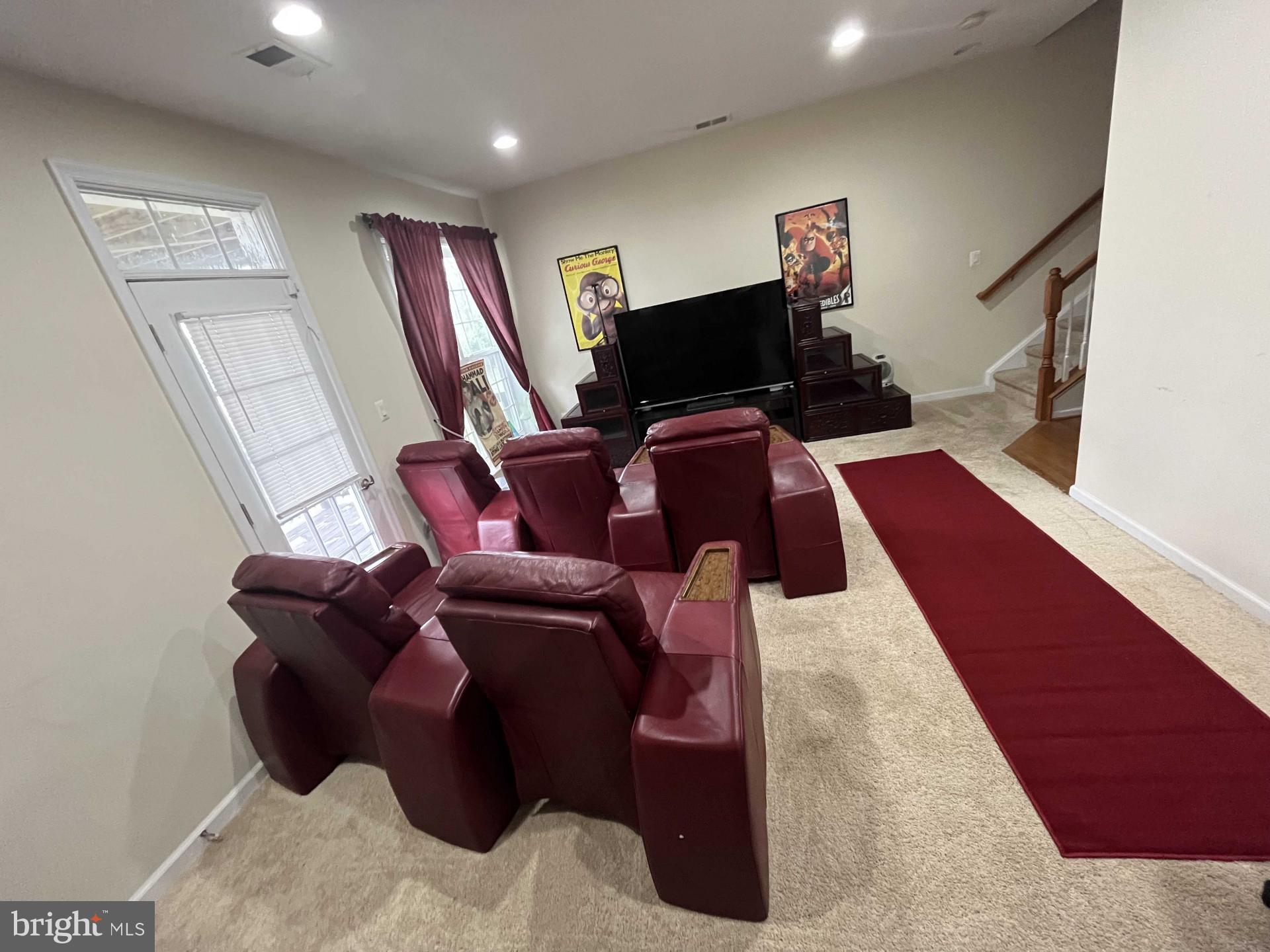 17696 Possum Point Road Dumfries, VA 22026 - Photo 17 of 45 a living room with furniture and a flat screen tv