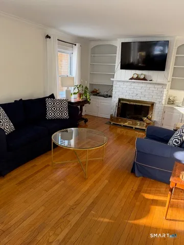 a living room with furniture and a lamp