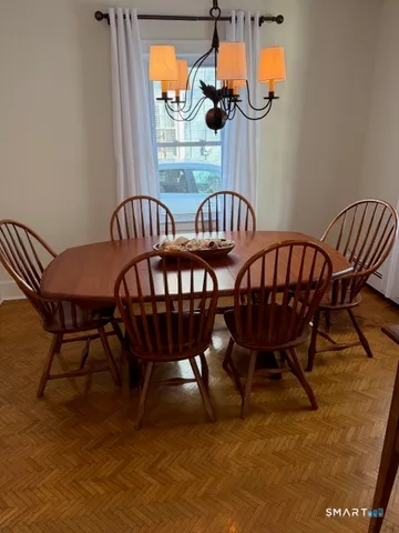 a kitchen with wooden floors and a stove