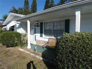 4392 Craftsbury Drive New Port Richey, FL 34652 - Photo 2 of 41 front view of a house with a yard