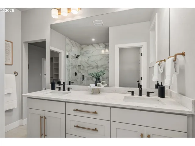 a bathroom with a sink vanity and a mirror