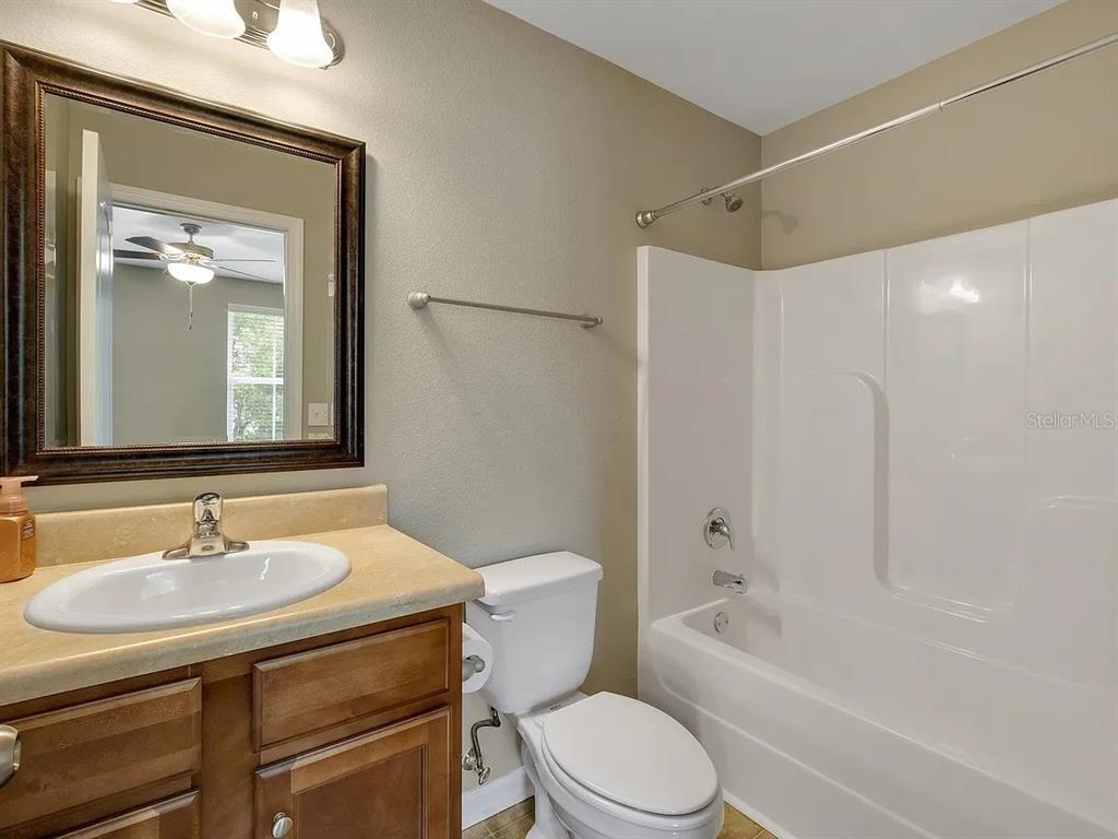 3660 Tyson Road, Unit 707 Tallahassee, FL 32310 - Photo 12 of 14 a bathroom with a sink toilet and shower