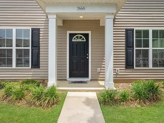 3660 Tyson Road, Unit 707 Tallahassee, FL 32310 - Photo 2 of 14 a front view of a house with a garden