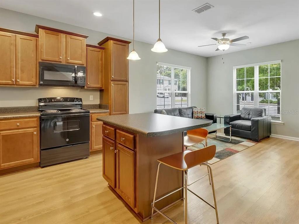3660 Tyson Road, Unit 707 Tallahassee, FL 32310 - Photo 6 of 14 a kitchen with stainless steel appliances granite countertop a sink stove and refrigerator