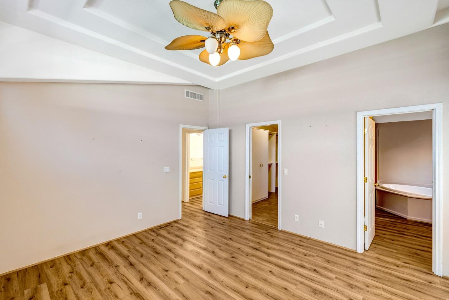 700 Briggs Street, Unit 84 Pacific Grove, CA 93950 - Photo 18 of 34 a view of room with wooden floor and ceiling fan
