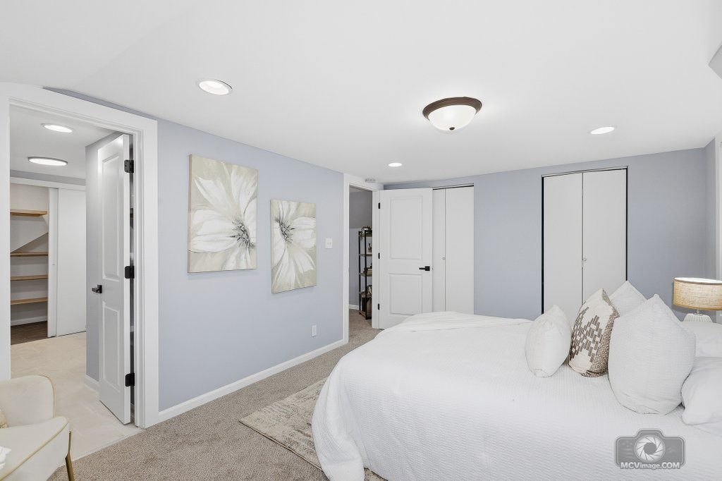 440 Engle Street Dolton, IL 60419 - Photo 13 of 19 a bedroom with a large bed and a chandelier