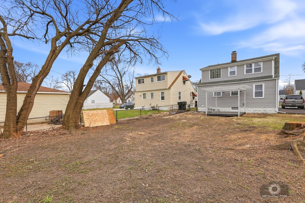 440 Engle Street Dolton, IL 60419 - Photo 18 of 19 a view of a house with a snow in the yard