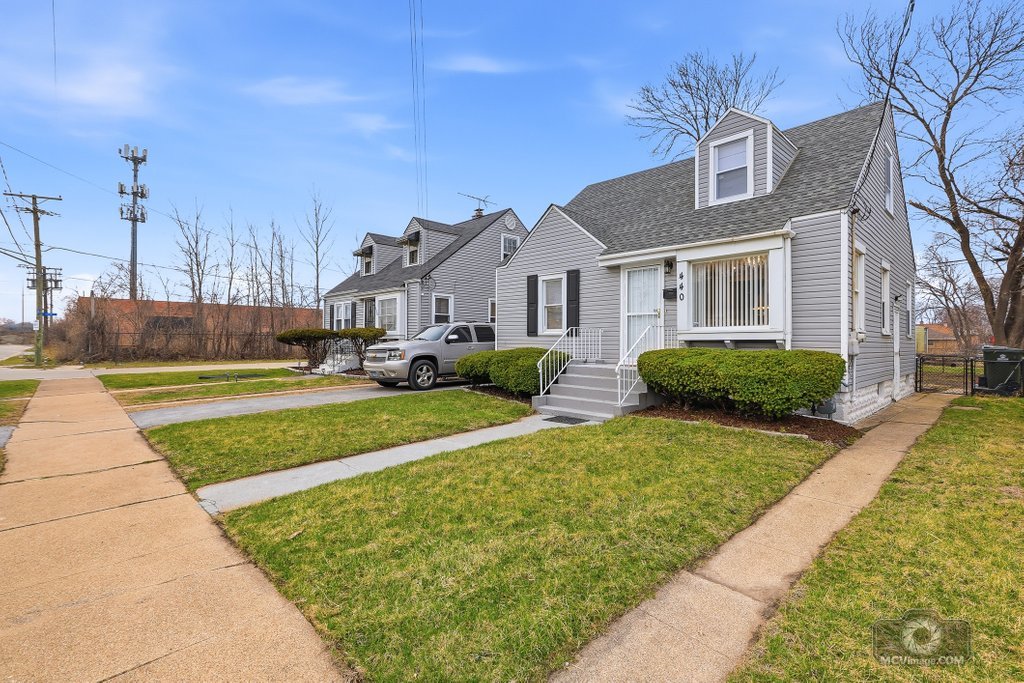 440 Engle Street Dolton, IL 60419 - Photo 2 of 19 a front view of a house with a yard