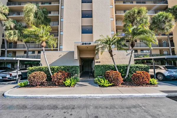 front view of a building with potted plants