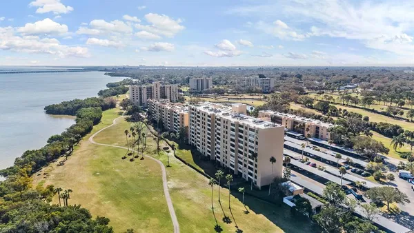 a view of building with outdoor space and ocean view