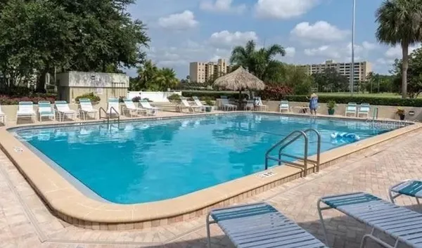 a view of pool with outdoor seating