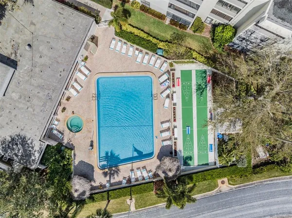 a room with wooden floor and furniture