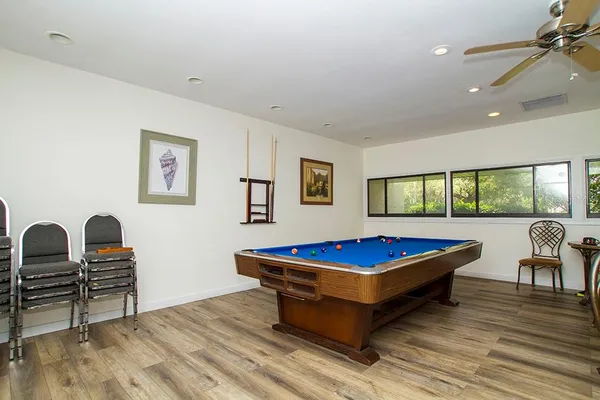 a view of a swimming pool with a lounge chairs