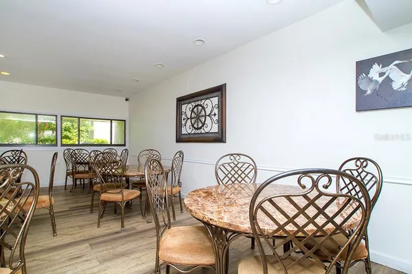 a car parked in the grass near a lake