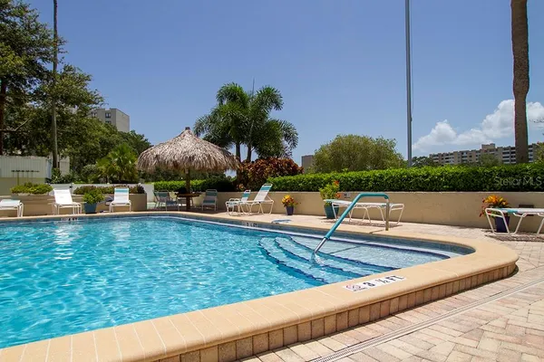 a view of outdoor space with dining table and chairs