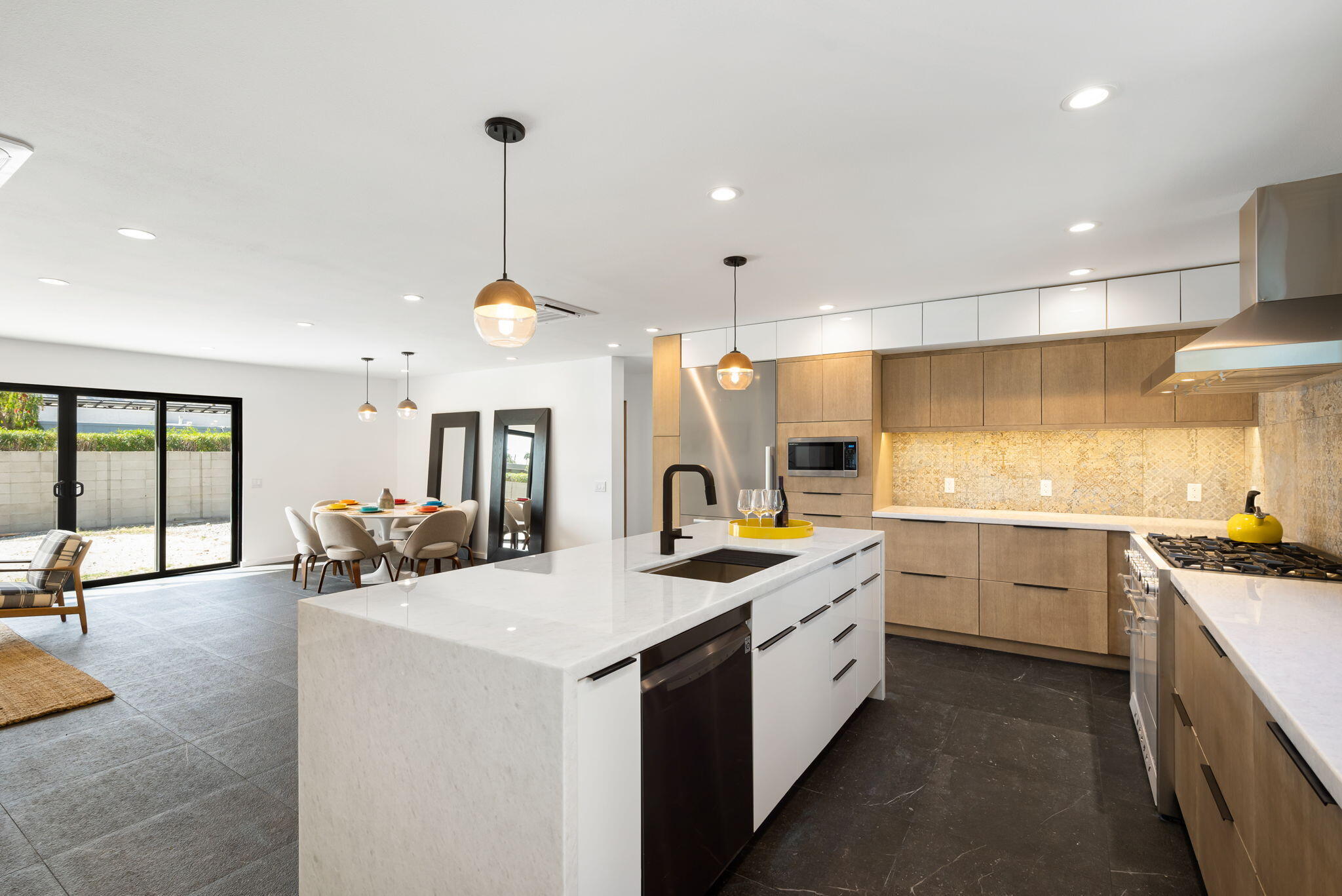 70131 Chappel Road Rancho Mirage, CA 92270 - Photo 1 of 42 a kitchen with sink stove and cabinets