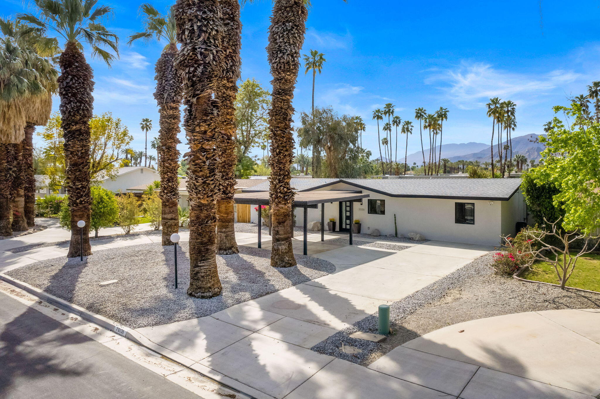 70131 Chappel Road Rancho Mirage, CA 92270 - Photo 2 of 42 a view of a patio with a table and chairs