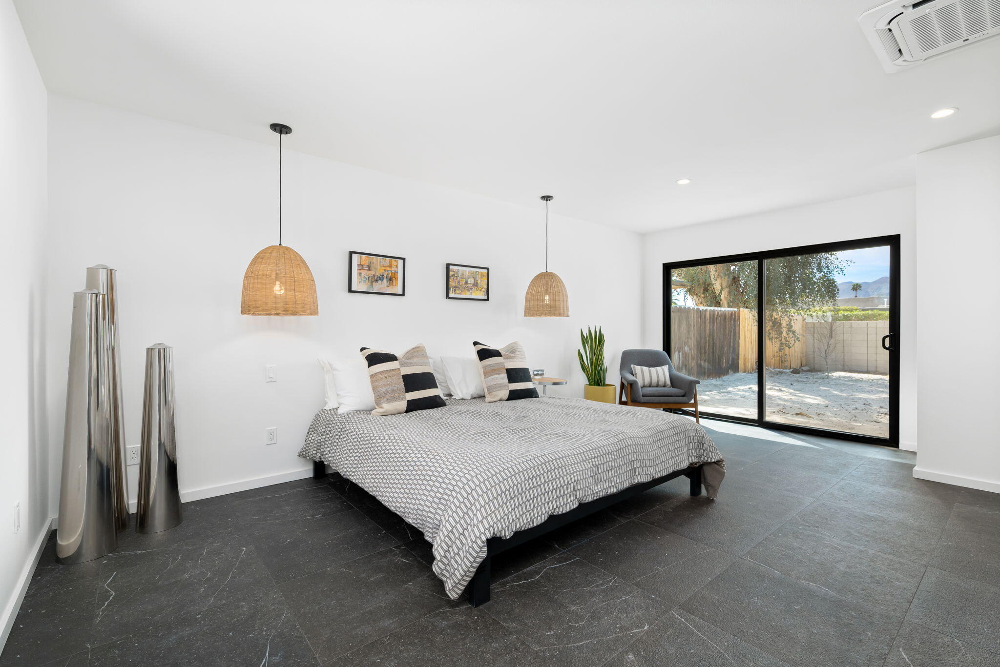 70131 Chappel Road Rancho Mirage, CA 92270 - Photo 22 of 42 a spacious bedroom with a bed and large mirror