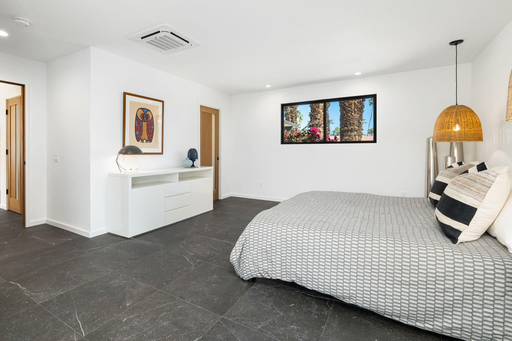 70131 Chappel Road Rancho Mirage, CA 92270 - Photo 23 of 42 a bedroom with a bed and a window