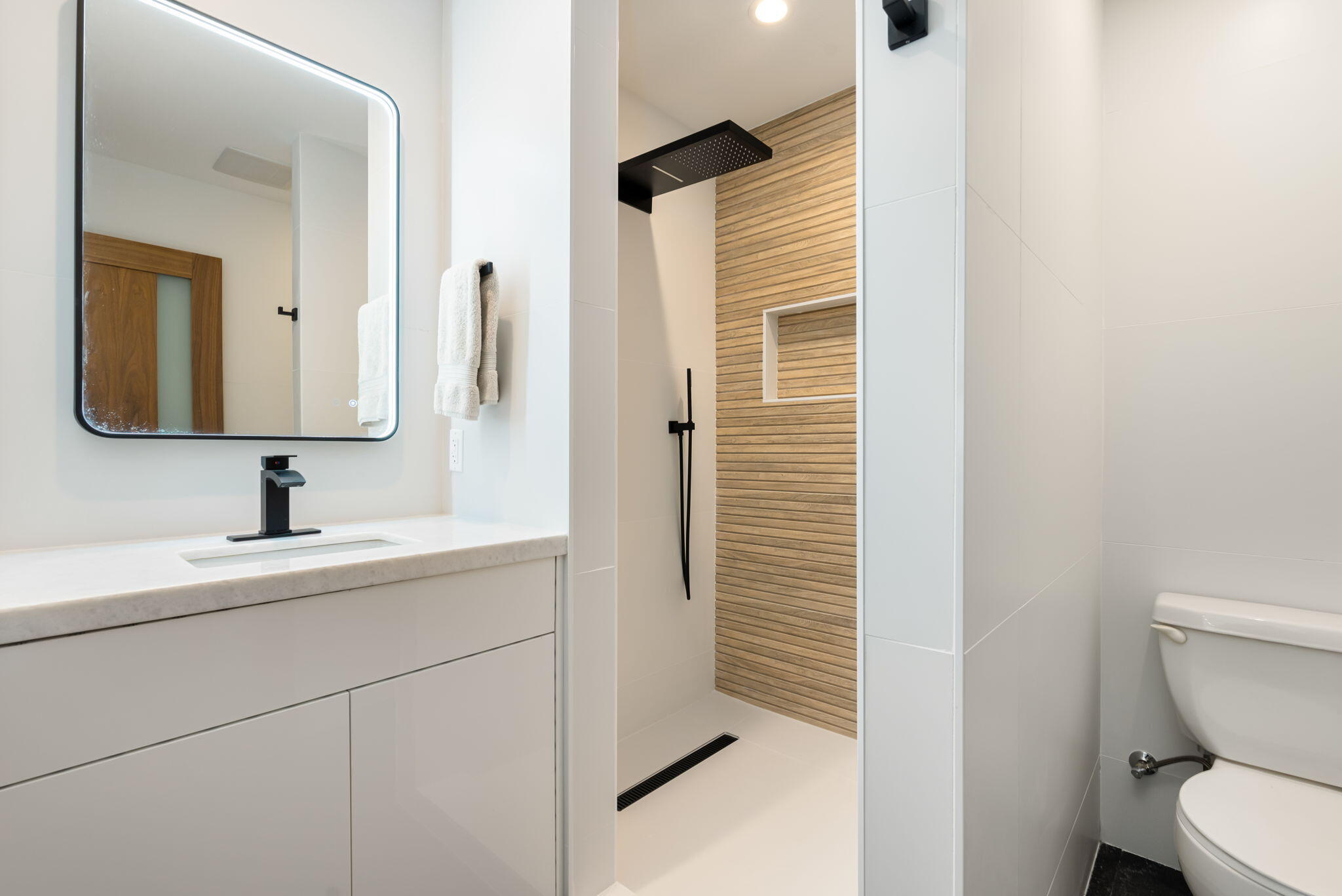 70131 Chappel Road Rancho Mirage, CA 92270 - Photo 26 of 42 a bathroom with a toilet sink a mirror and shower