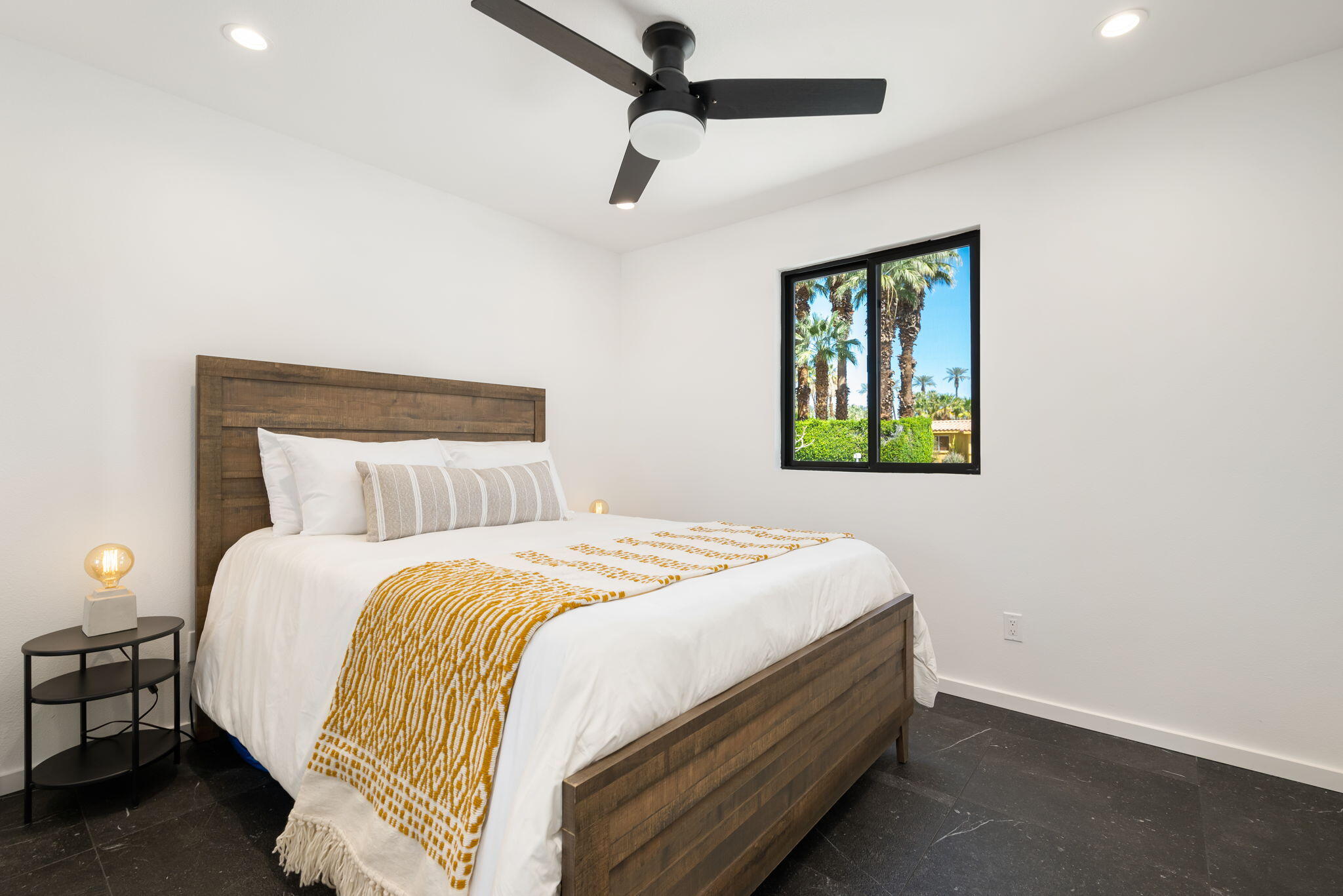 70131 Chappel Road Rancho Mirage, CA 92270 - Photo 27 of 42 a bedroom with a bed and a window