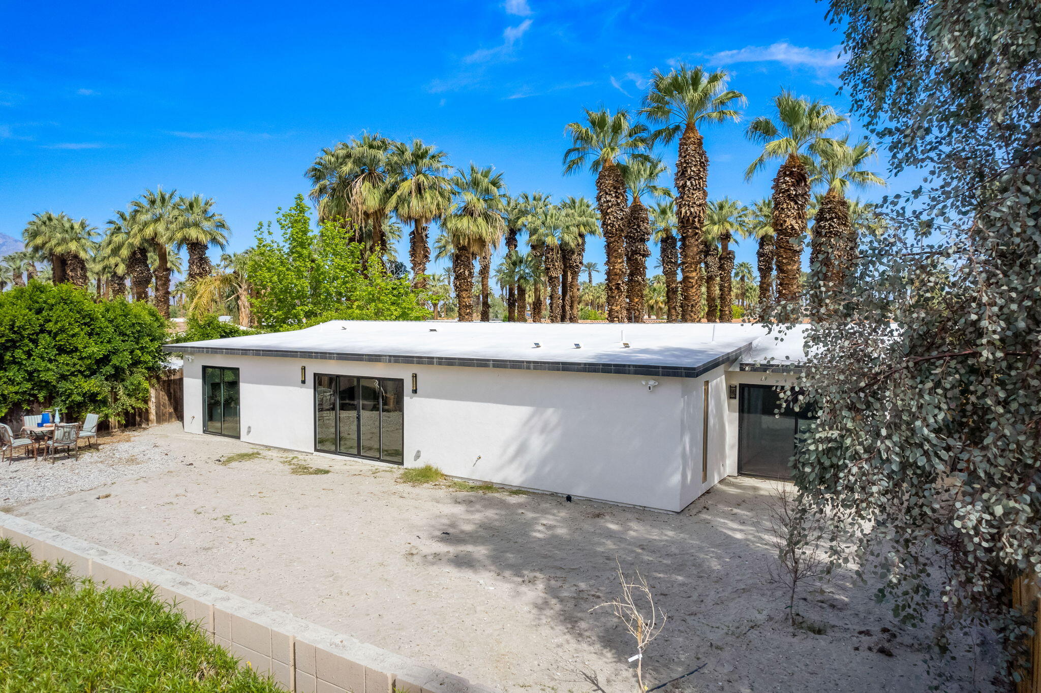 70131 Chappel Road Rancho Mirage, CA 92270 - Photo 36 of 42 a view of a house with a backyard and a tree
