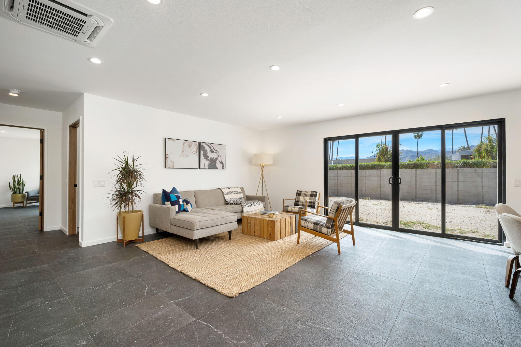 70131 Chappel Road Rancho Mirage, CA 92270 - Photo 9 of 42 a living room with furniture and large windows