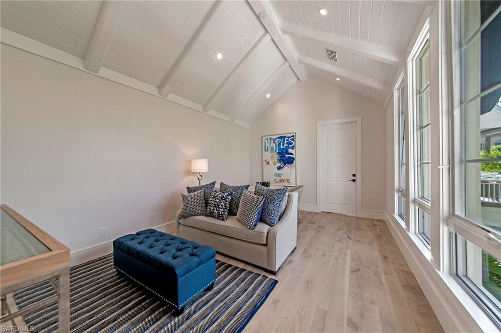 434 3rd Avenue South Naples, FL 34102 - Photo 11 of 24 a living room with furniture and a rug