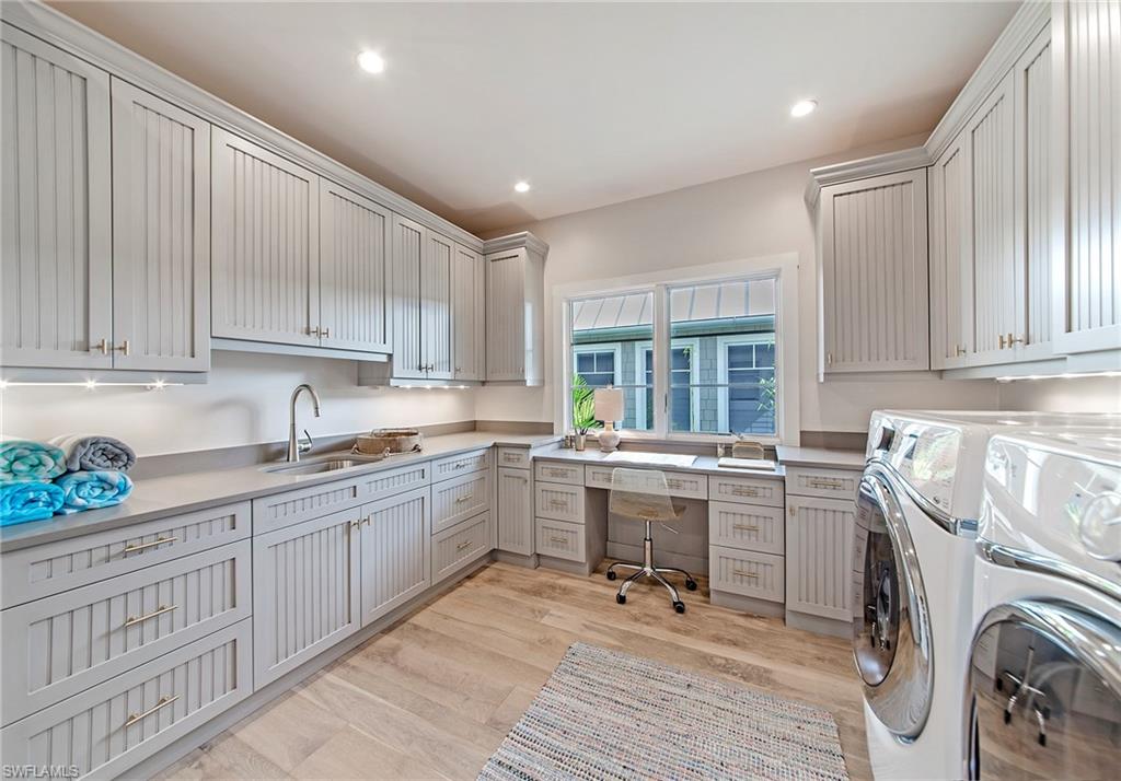 434 3rd Avenue South Naples, FL 34102 - Photo 15 of 24 a kitchen with sink cabinets and window
