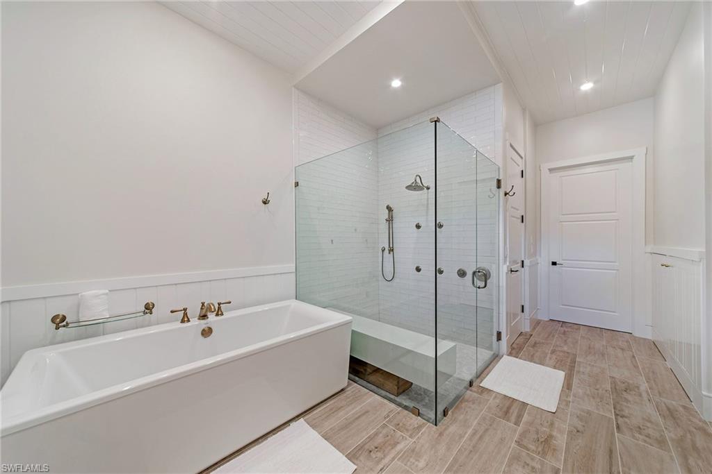 434 3rd Avenue South Naples, FL 34102 - Photo 16 of 24 a spacious bathroom with a bathtub and a shower