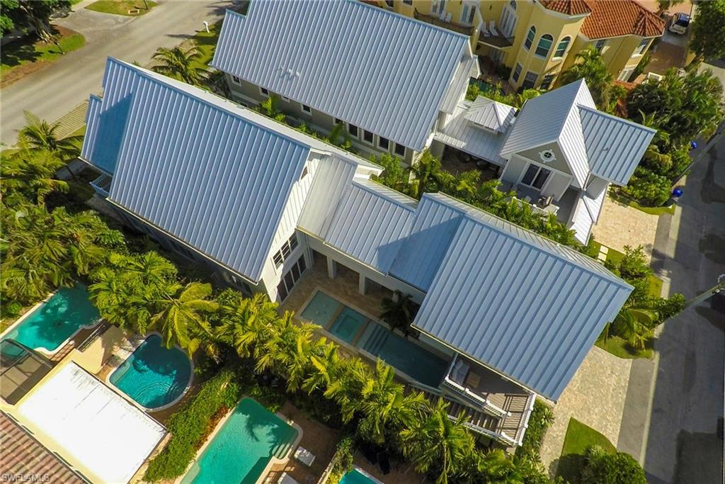 434 3rd Avenue South Naples, FL 34102 - Photo 24 of 24 a view of a patio with a table and chairs